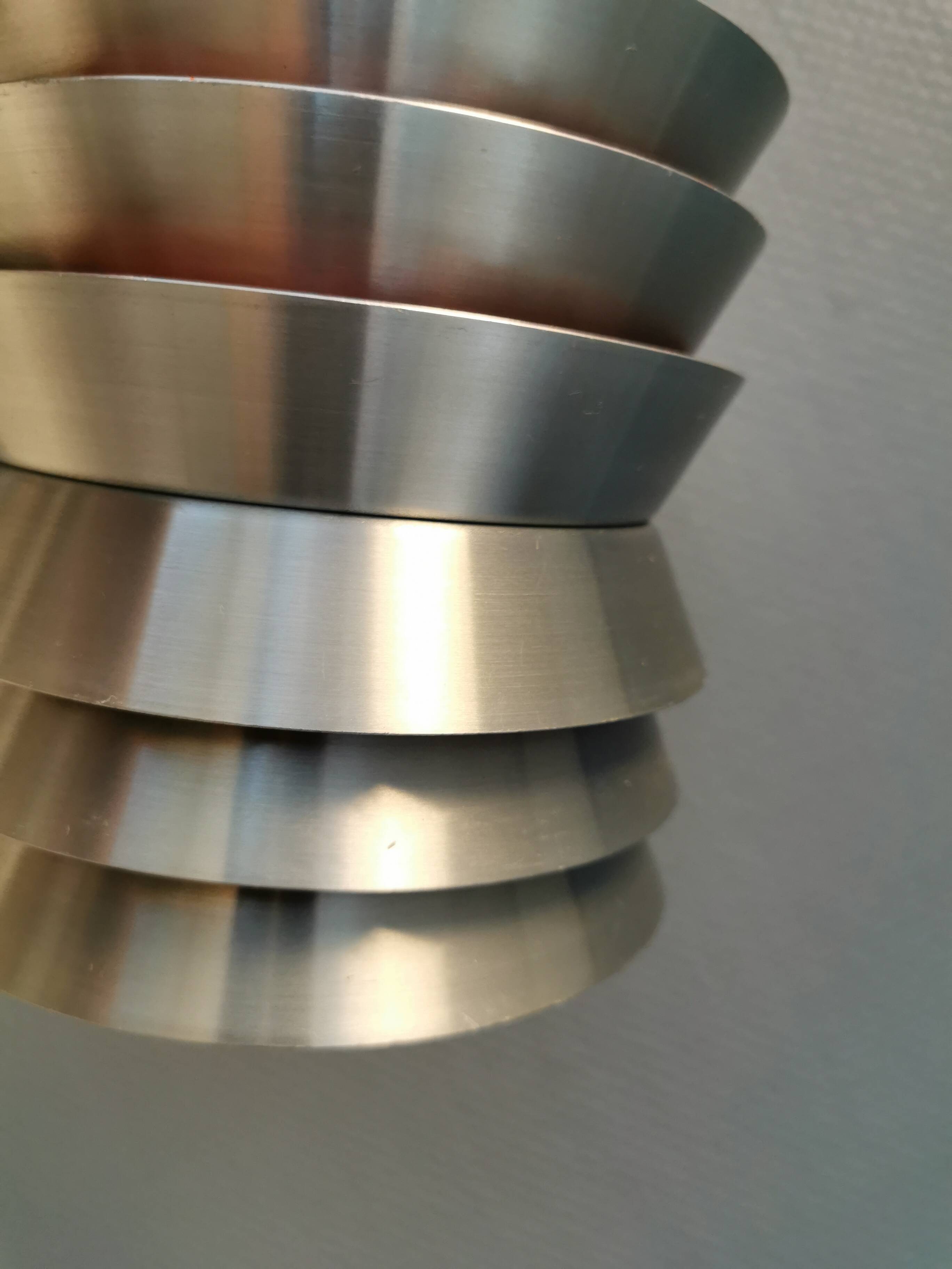 Danish/Swedish hanging lamp, in silver-coloured aluminium with orange interior paint.