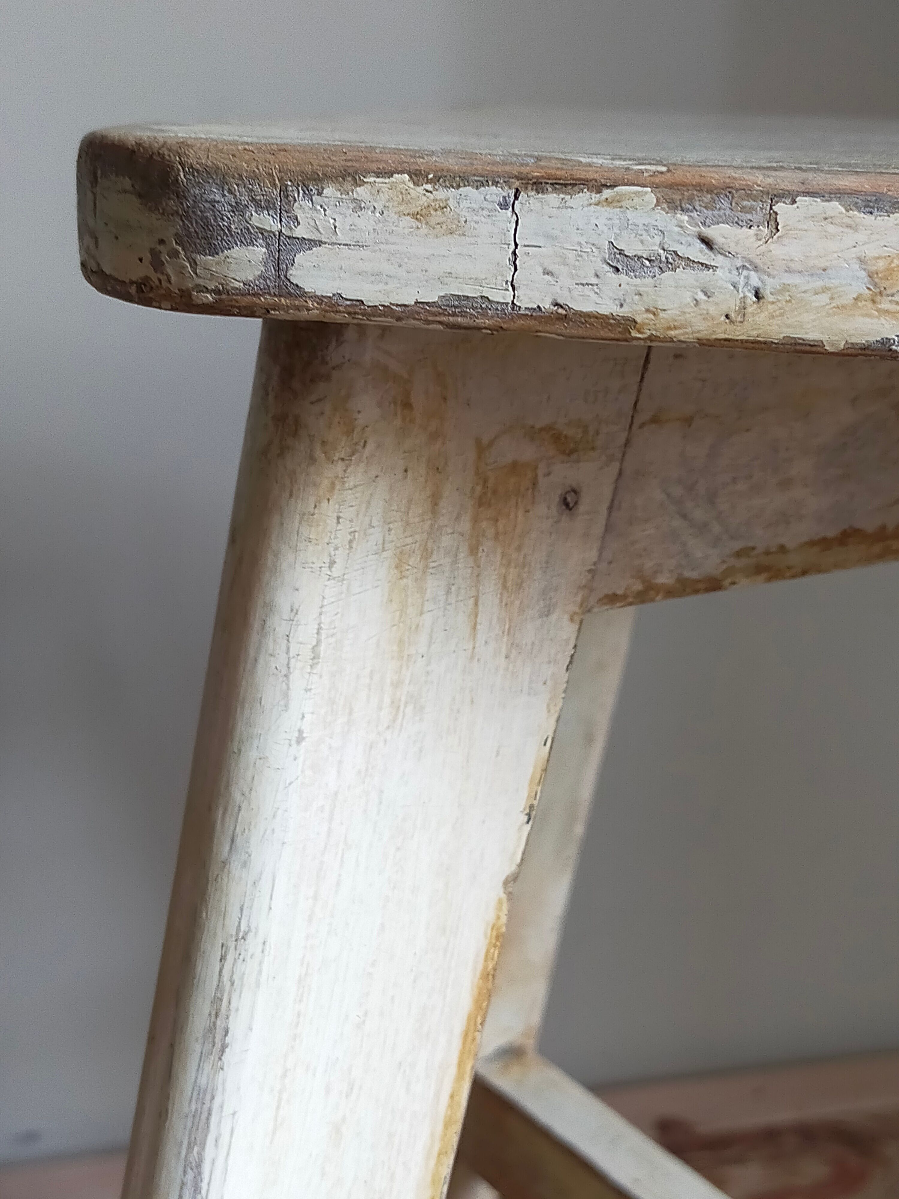 Old workshop stool in patinated solid wood