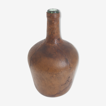 Demijohn covered leather