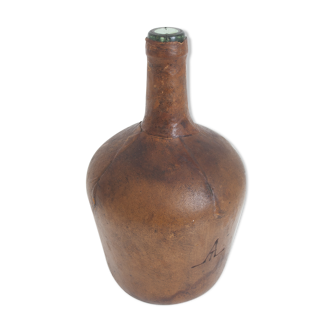 Demijohn covered leather