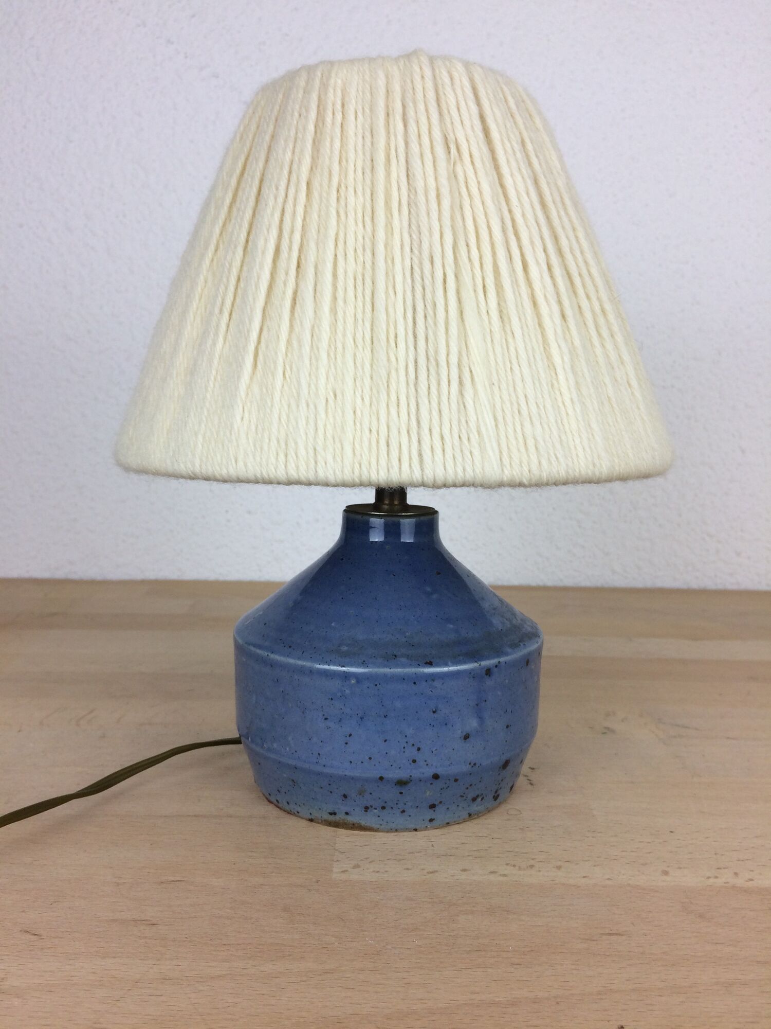 Blue ceramic lamp foot and white wool lampshade