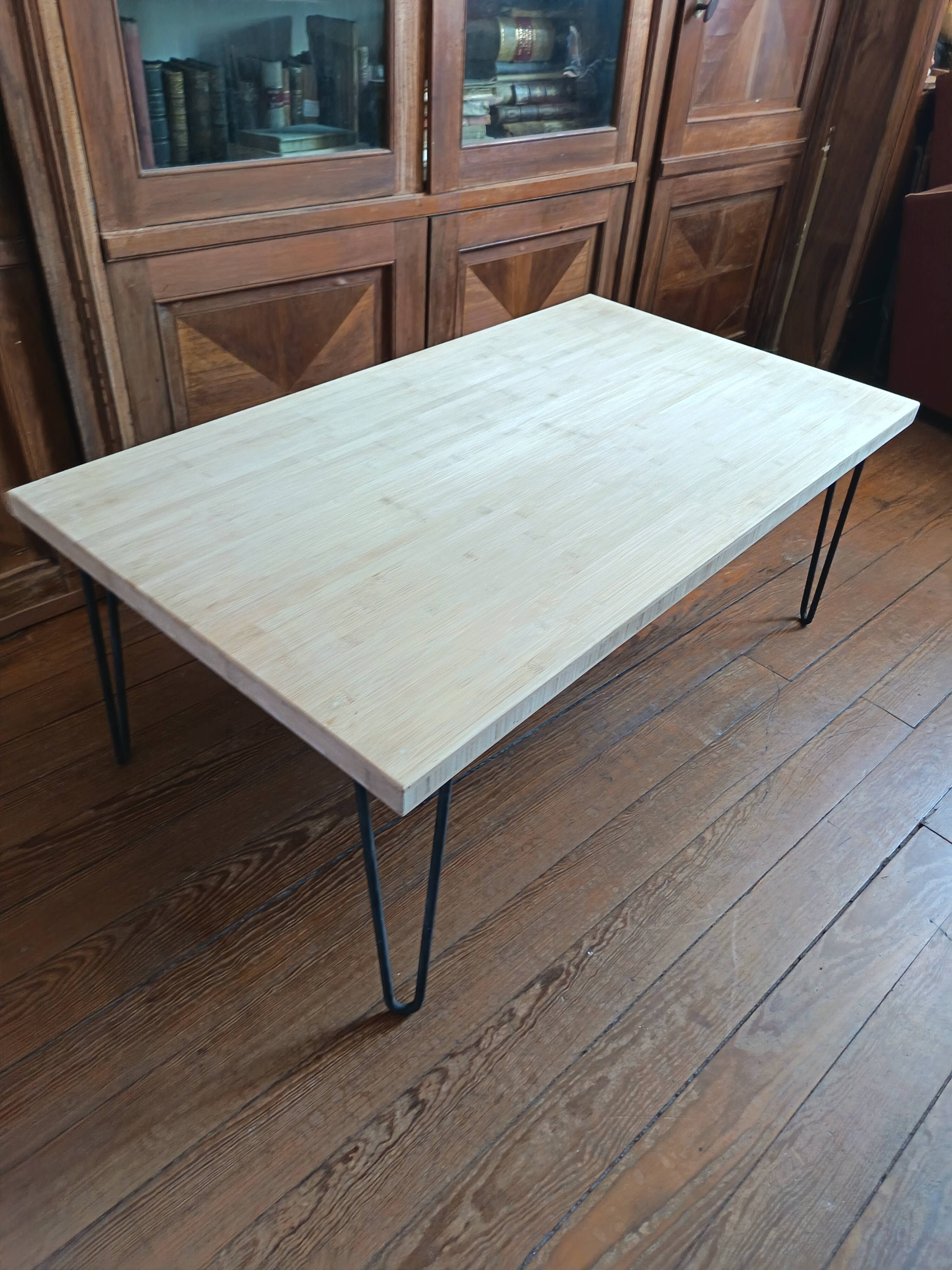 Coffee table in solid bamboo with steel legs.