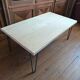 Coffee table in solid bamboo with steel legs.