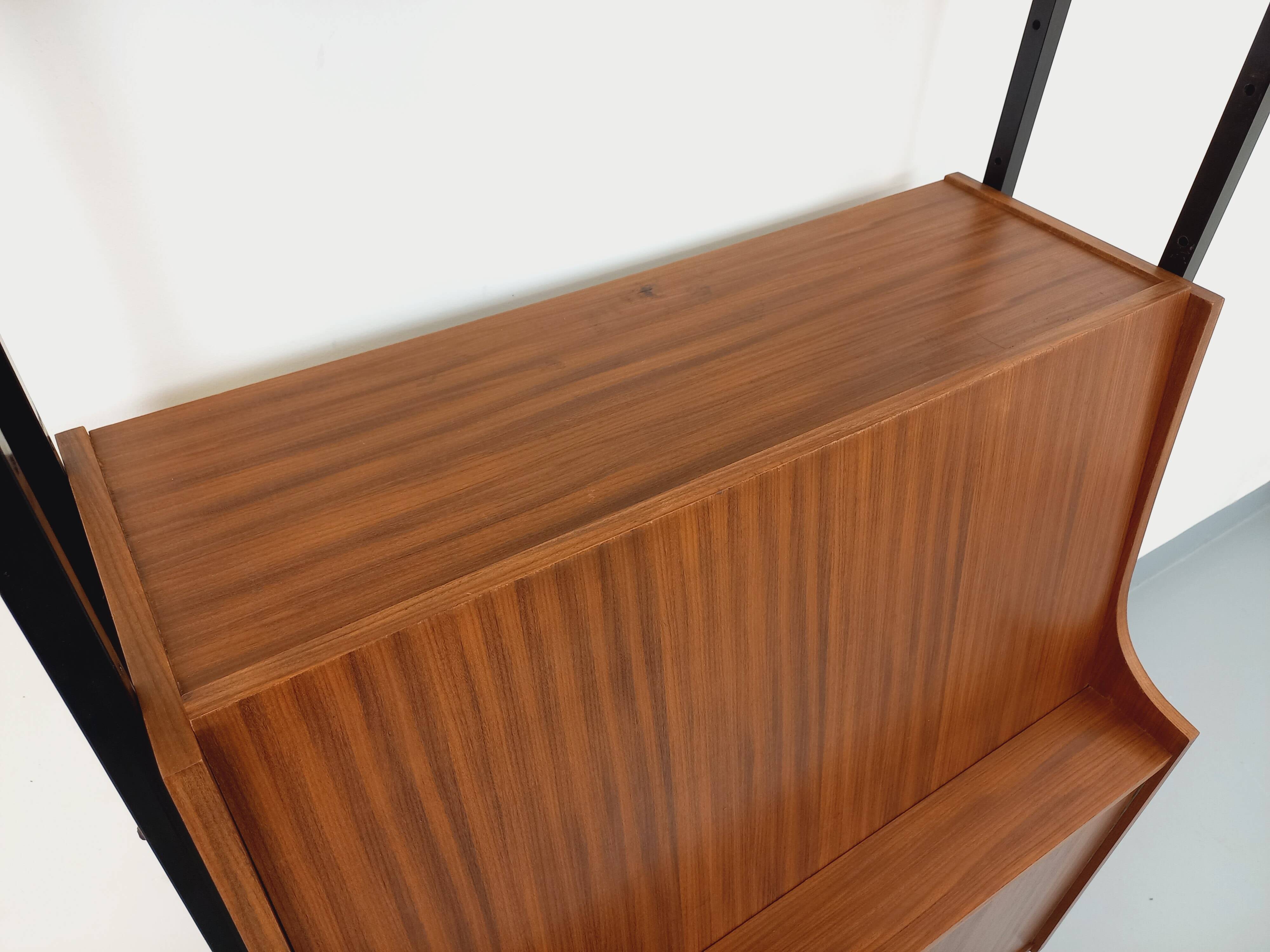 Vintage modular secretary bookshelf in teak and metal.