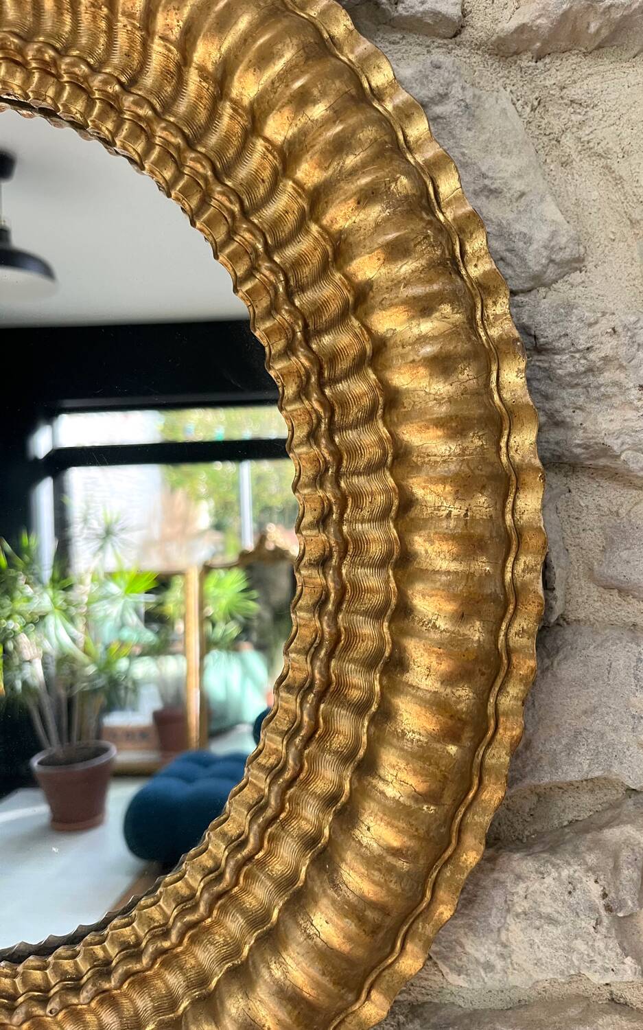 Pair of antique oval mirrors gilded with gold leaf and mercury.