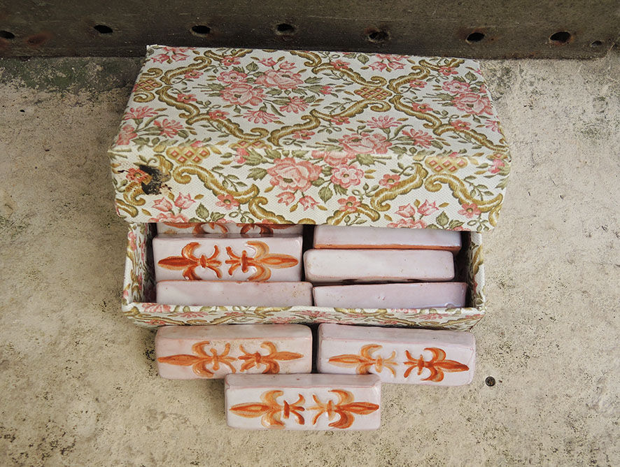 12 ancient fleur de lys knife holders in terracotta