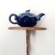 Blue ceramic Art Deco teapot with a frog.