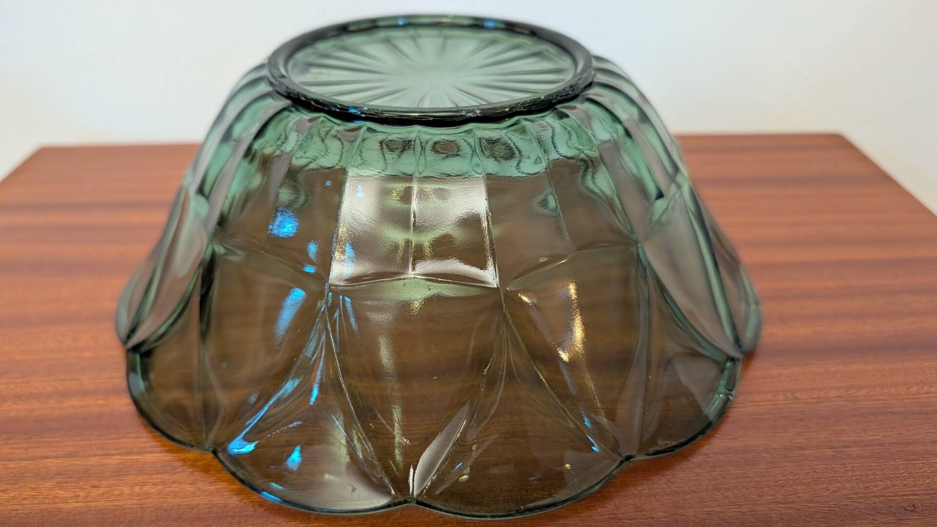 Vintage green smoked glass coupe with geometric decoration.