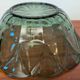 Vintage green smoked glass coupe with geometric decoration.