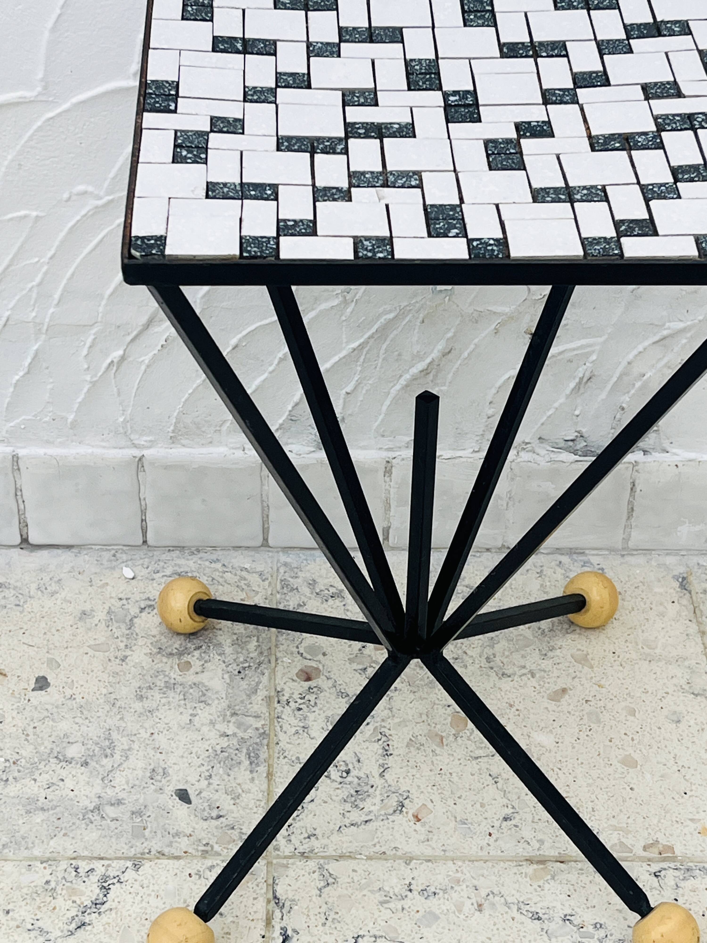 Wrought iron stela and black and white tiled top from the 1960s.