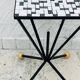 Wrought iron stela and black and white tiled top from the 1960s.