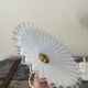 Suspension in electrified serrated white opaline to nine