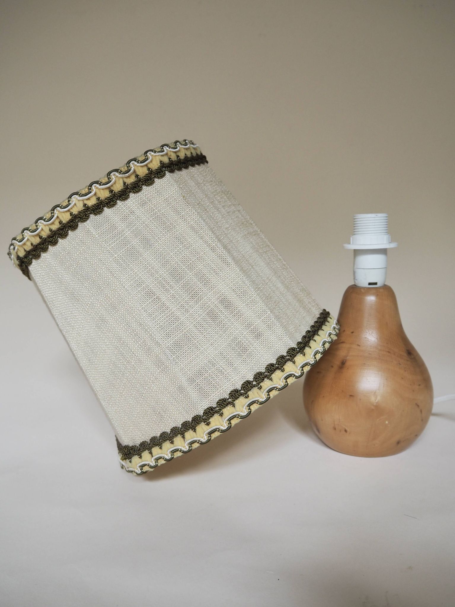Turned wooden lamp with linen shade