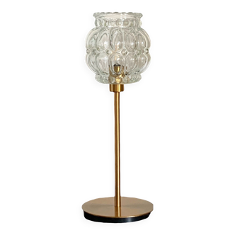 Table lamp with an antique glass globe lampshade and a gold base