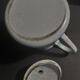 Enamelled sheet metal pourer decorated with black berries early twentieth century