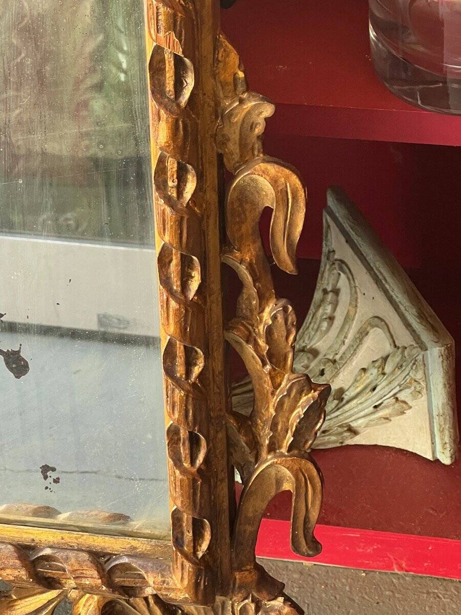 Antique mirror above a chest of drawers or between two windows, carved wood, 18th century