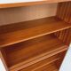 Vintage wooden bookshelf in teak style from the 1960s.