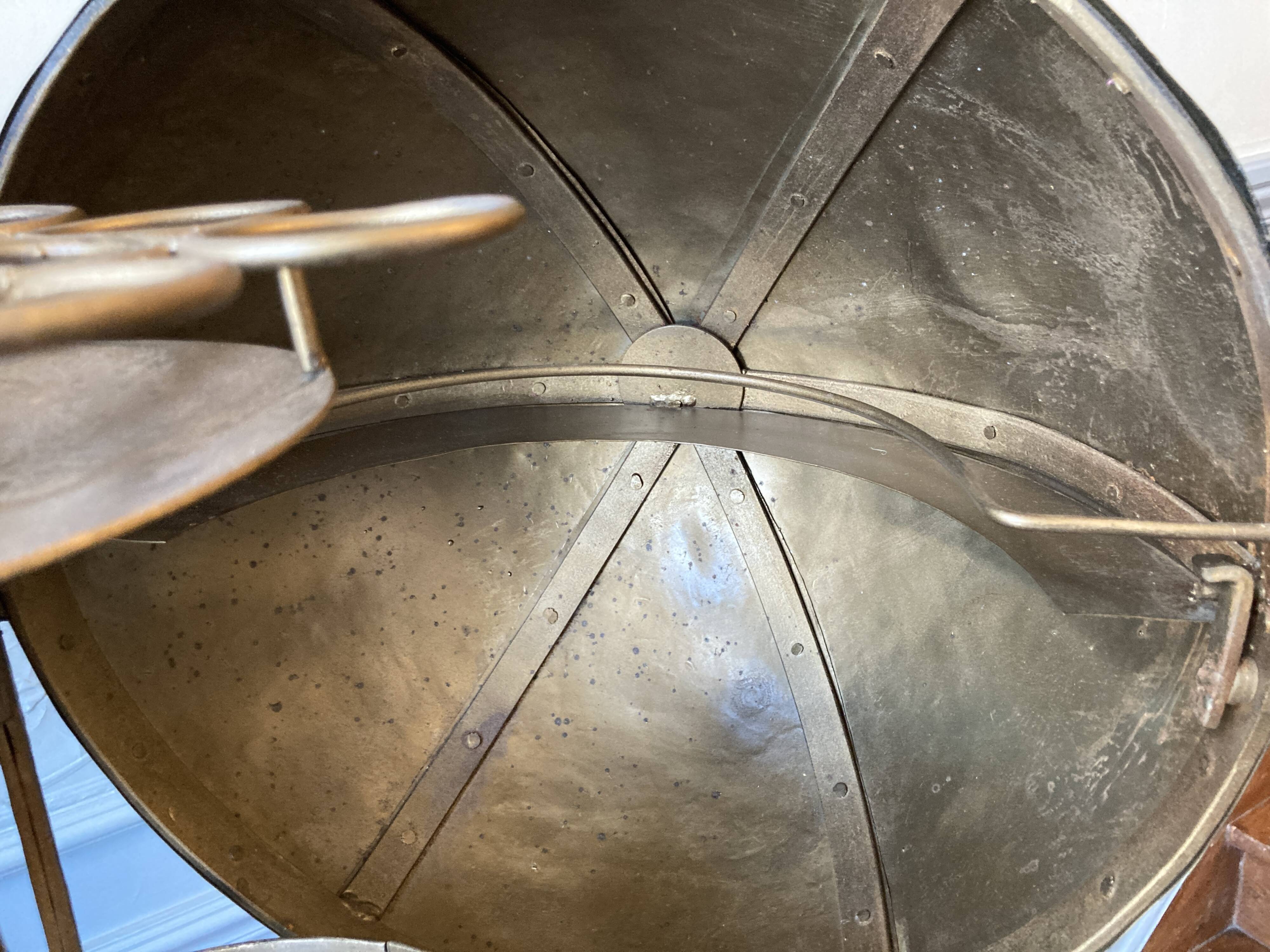 Atypical industrial furniture riveted sphere