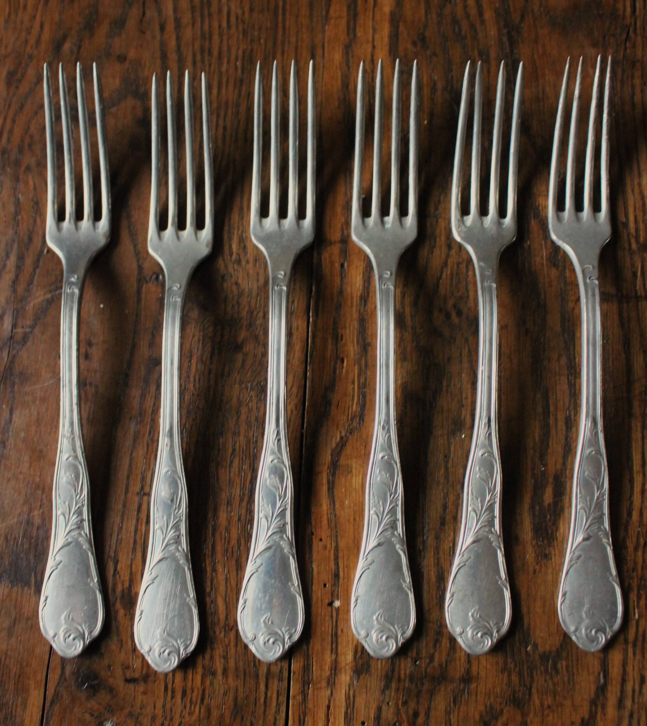 A set of 6 old flowered metal forks
