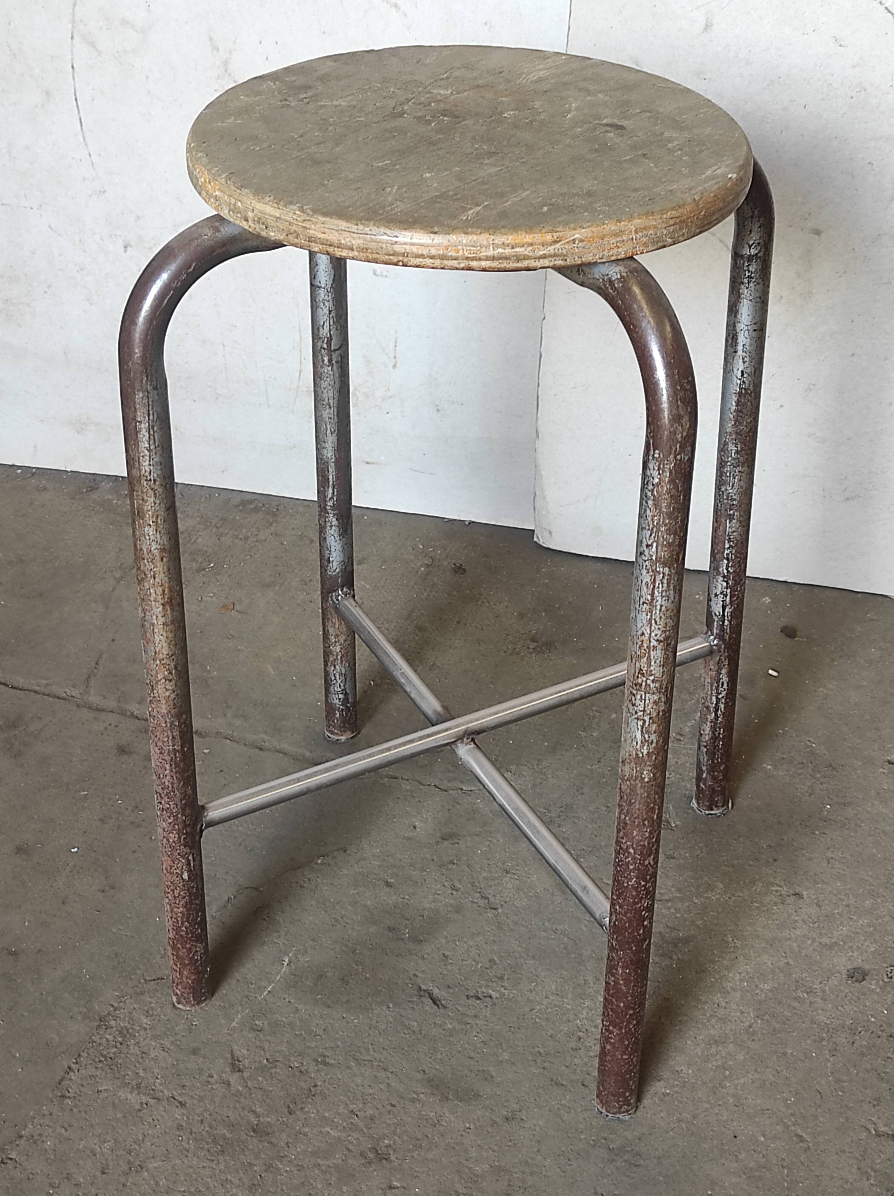 Old vintage metal and wood industrial workshop stool