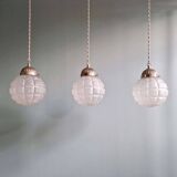 Art Deco trio of frosted glass pendants, 1920s-30s.
