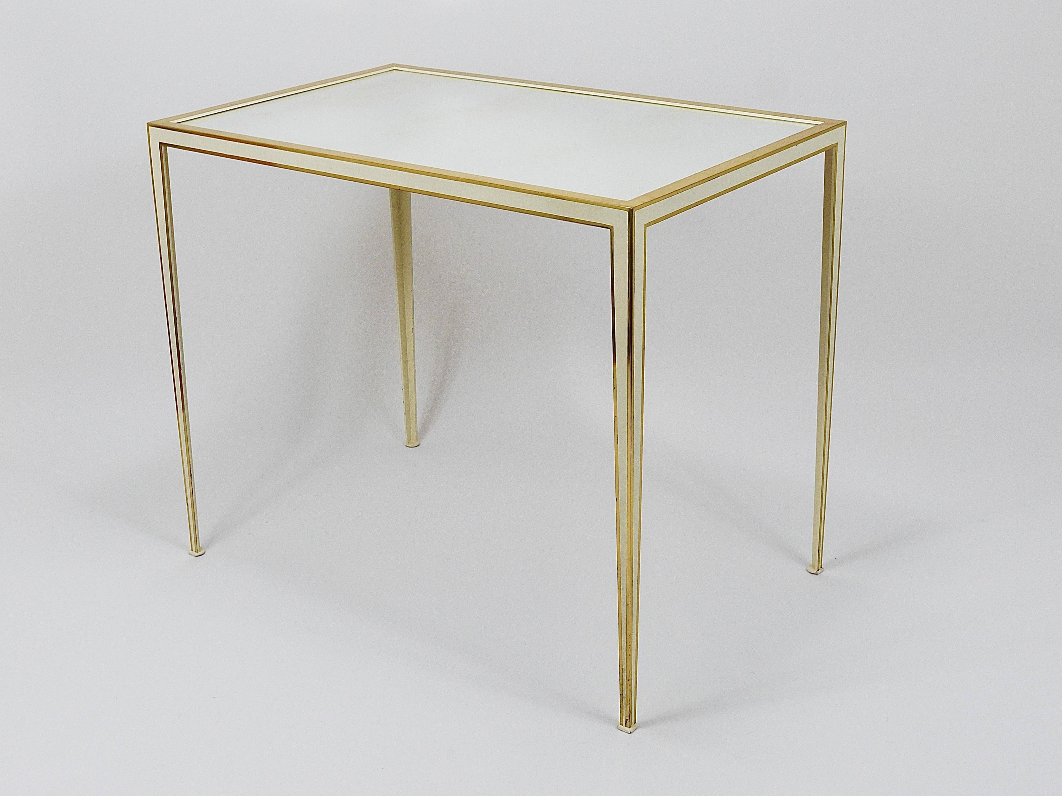 A pair of brass and white mirror tables from Vereinigte Werkstätten, Germany, 1970s.