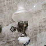 Pair of vintage wall sconces in brass, porcelain, and frosted glass.