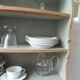 Small vintage bookcase, 5 fixed shelves, interior sublimated in verdigris, waxed finish.