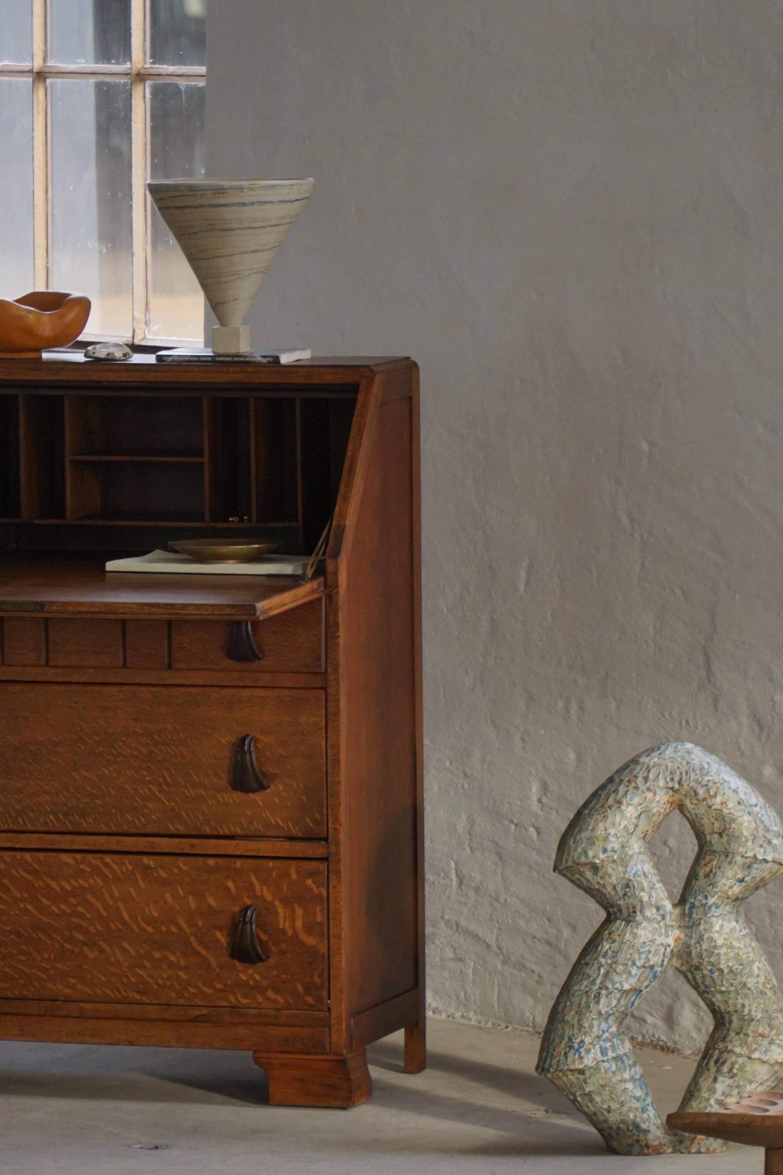 Desk / Chest of drawers in modern Danish oak from the early 20th century with shell handles.