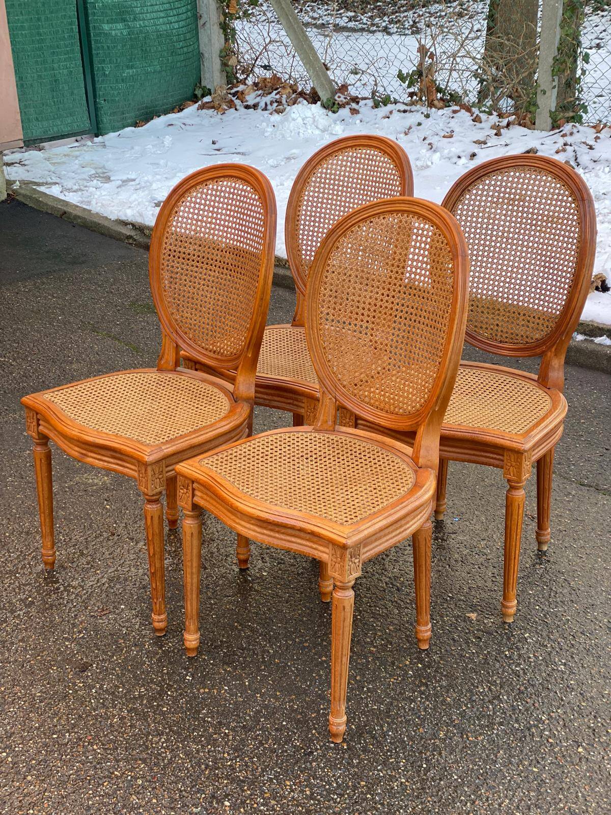 4 caned Louis XVI medallion dining chairs from the 19th century.