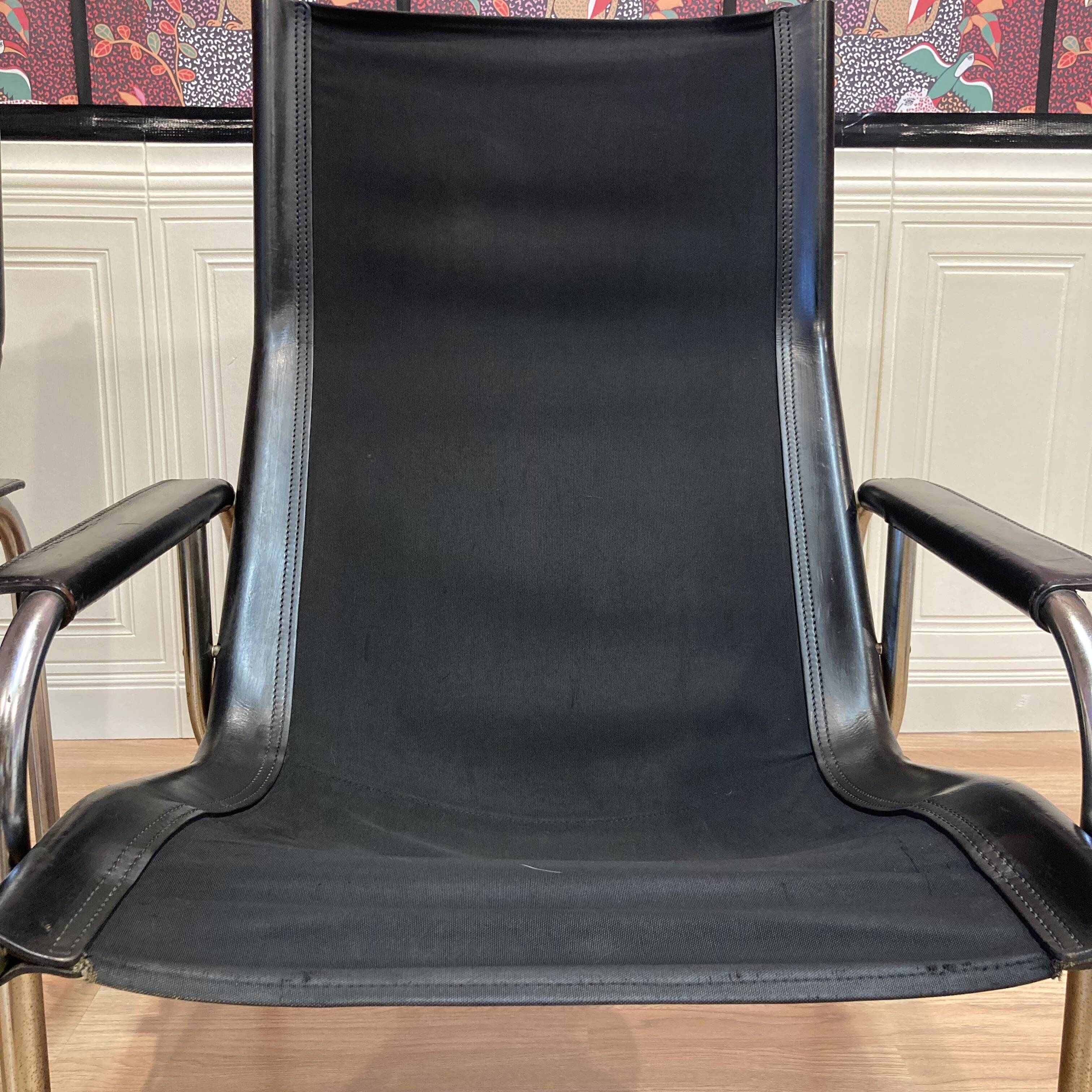 Reclining armchair in black leather and chrome design "hans eichenberger" 1960.