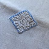 Embroidered cotton linen sheet with blue border