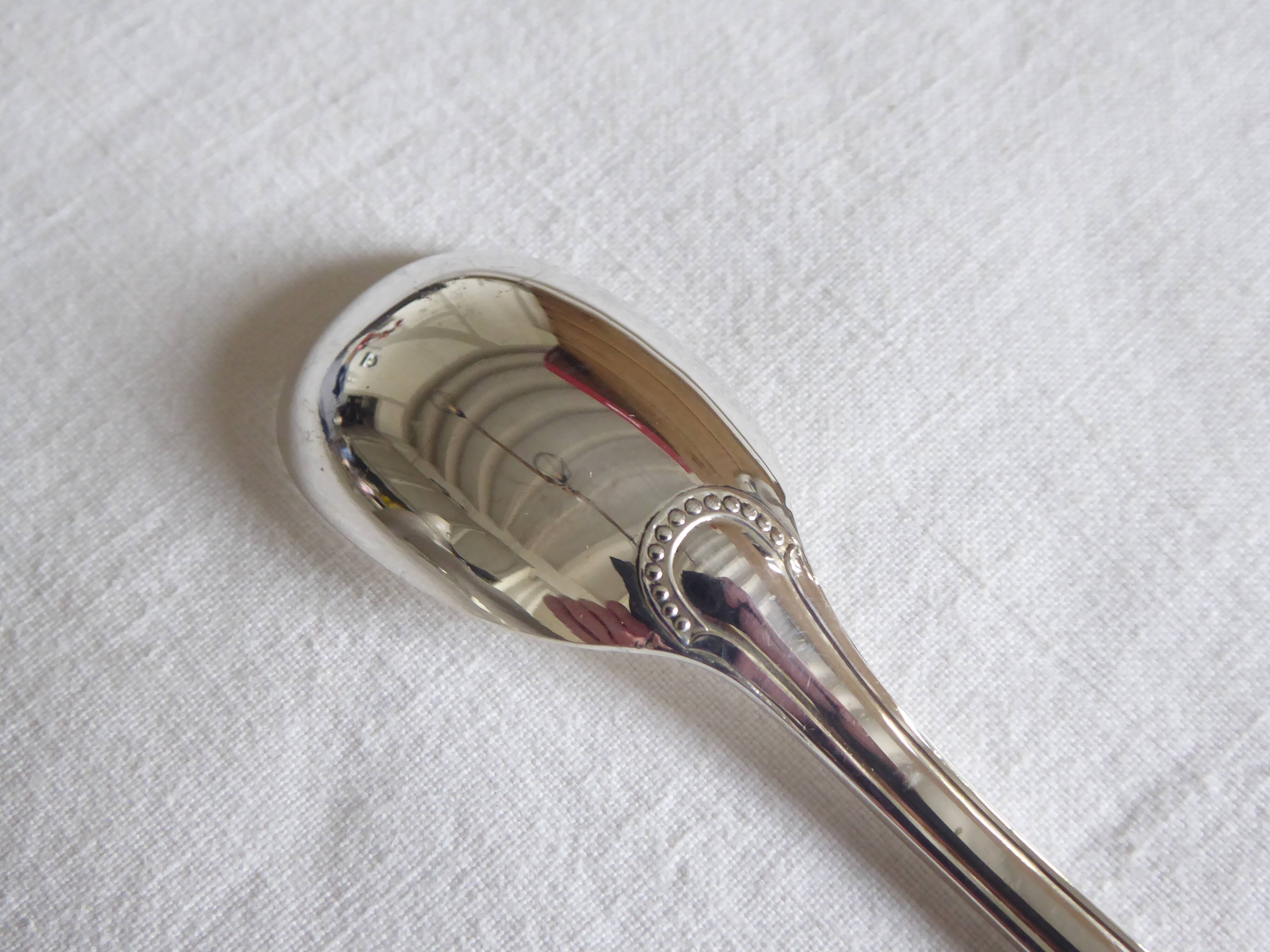 Cockerel + silver metal spoon