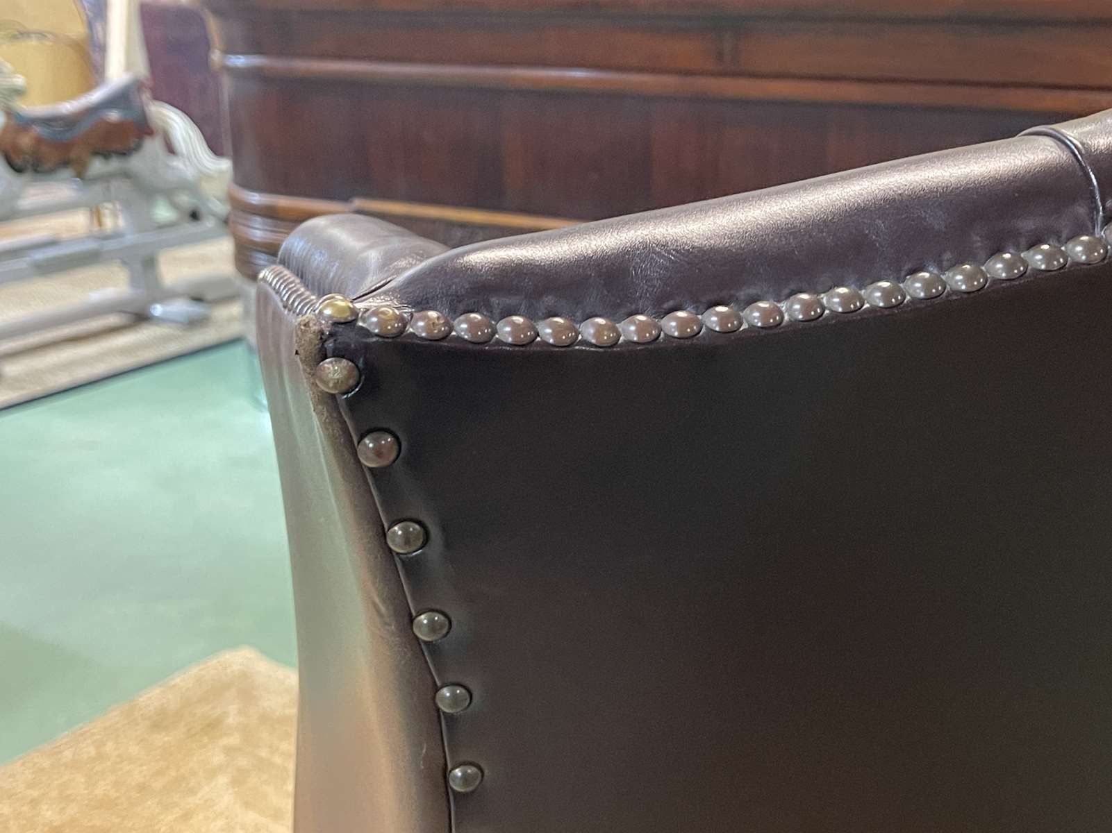 Chesterfield armchair with brown leather ears from the 1990s in very good condition