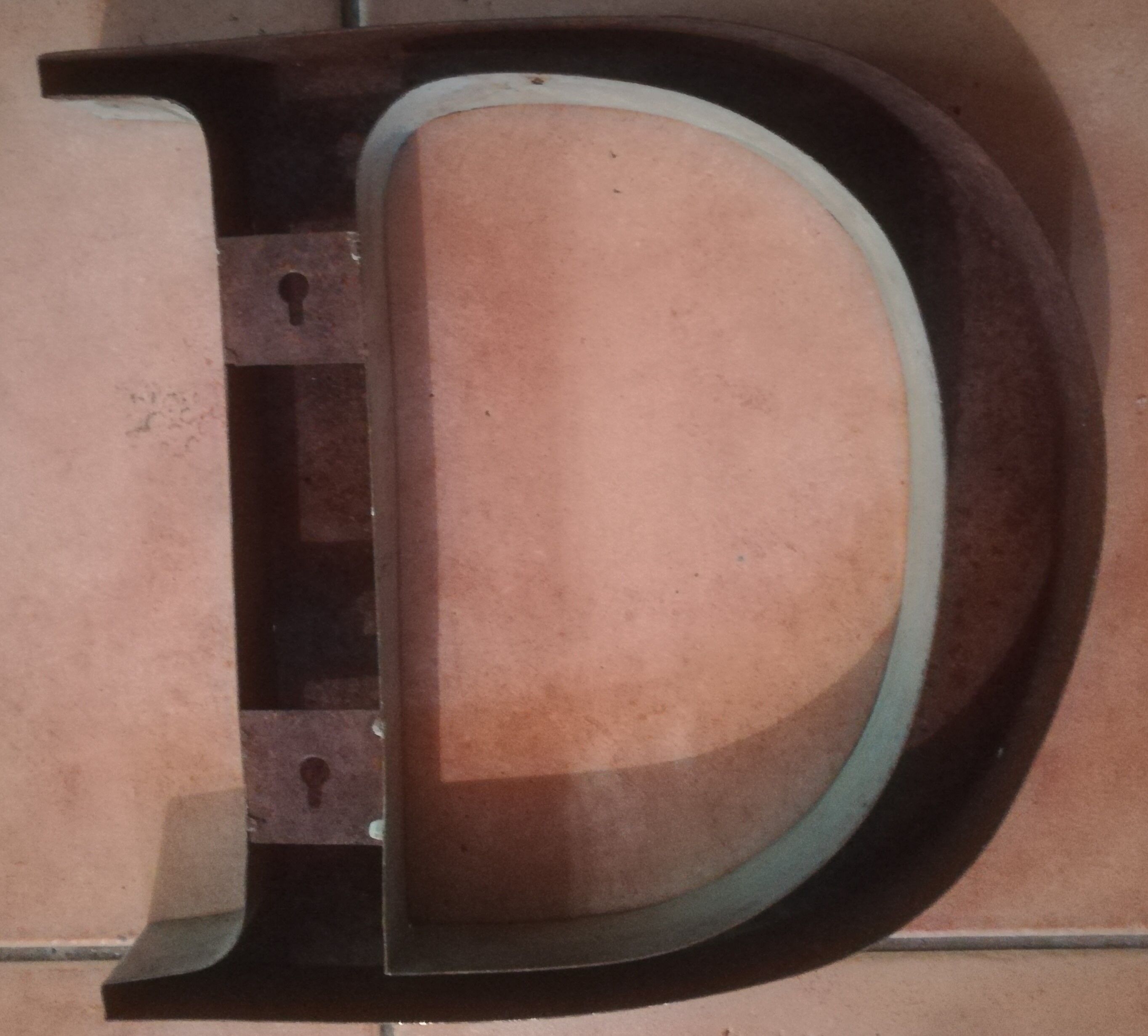Old letter in metal (sheet metal) "D"