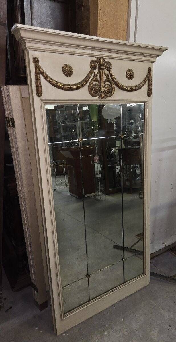 Louis XVI style trumeau mirror with a painted wooden frame.