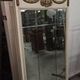 Louis XVI style trumeau mirror with a painted wooden frame.