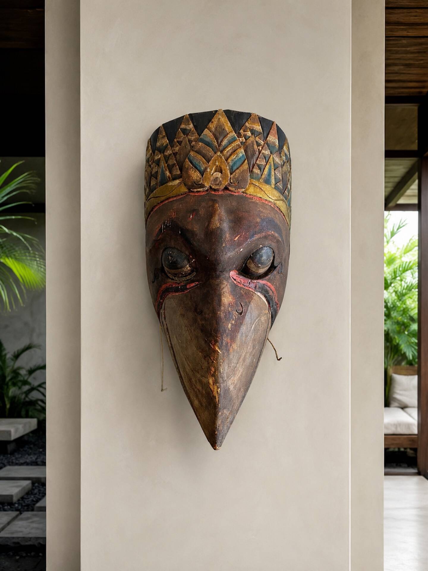 Grand traditional Indonesian mask carved from wood.