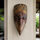 Grand traditional Indonesian mask carved from wood.