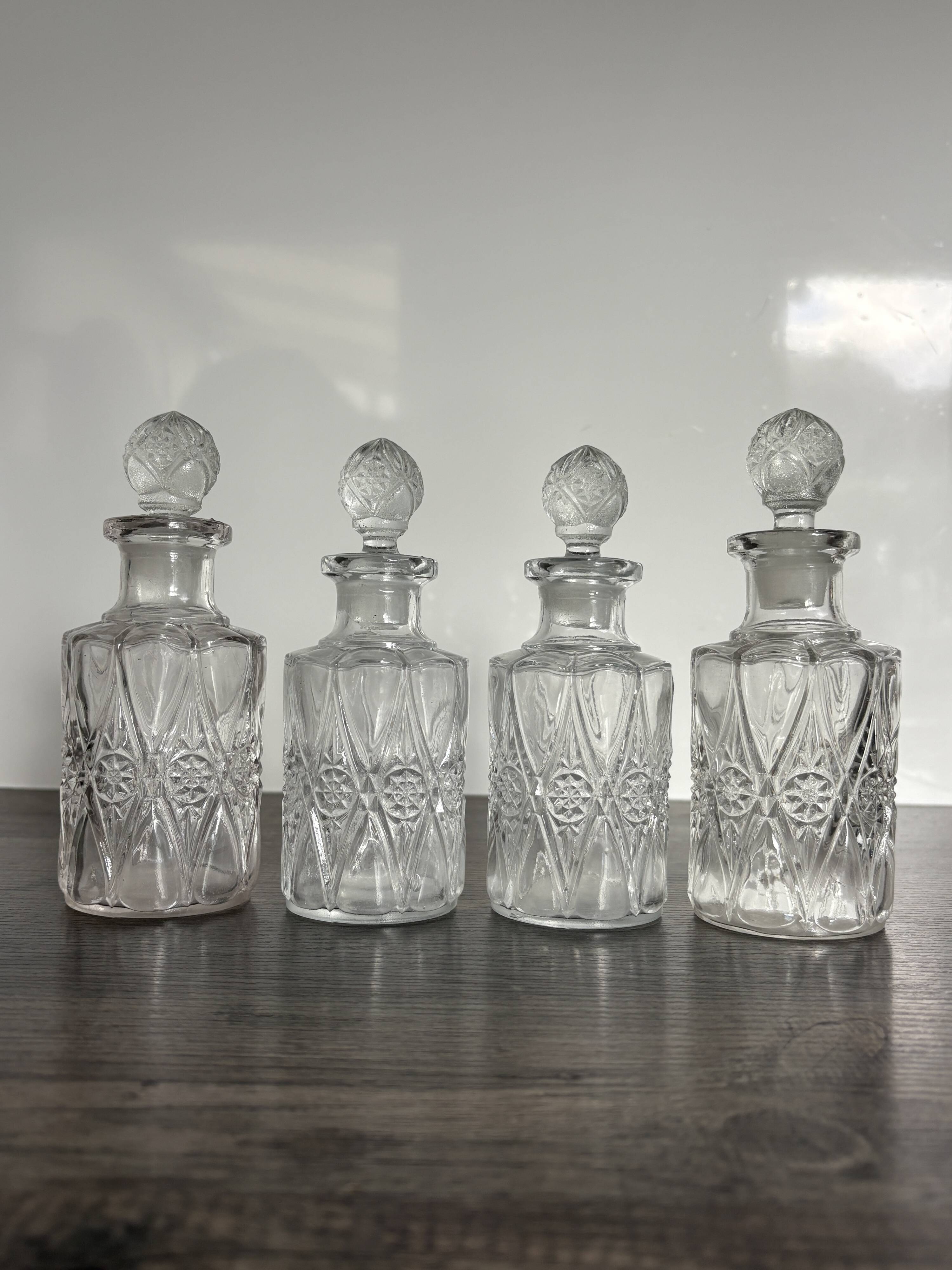 Set of 4 molded crystal bottles – Val Saint Lambert