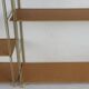 Etagère String en bois et métal doré 1960