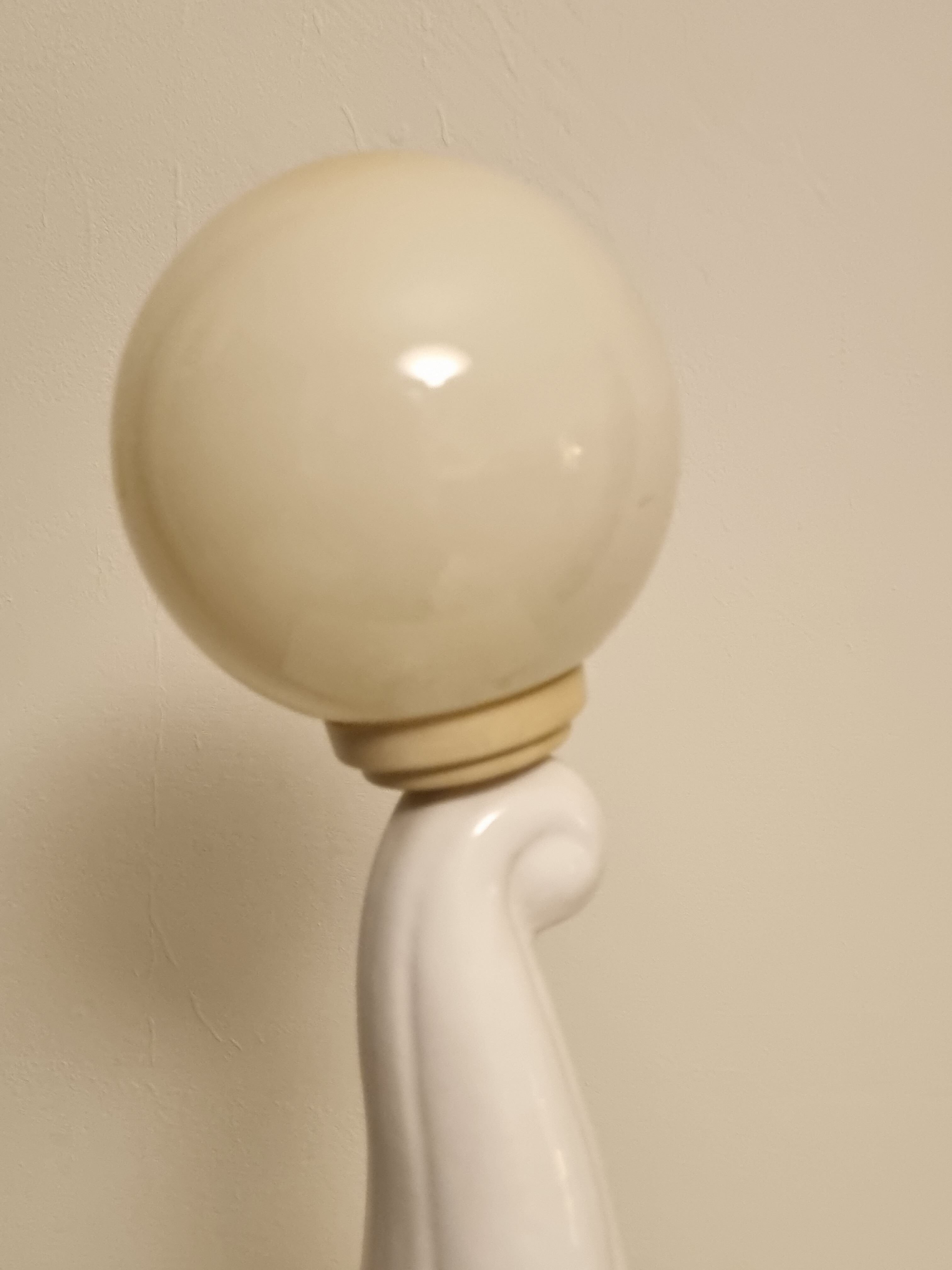 White ceramic table lamp, an elephant holding a lighted ball