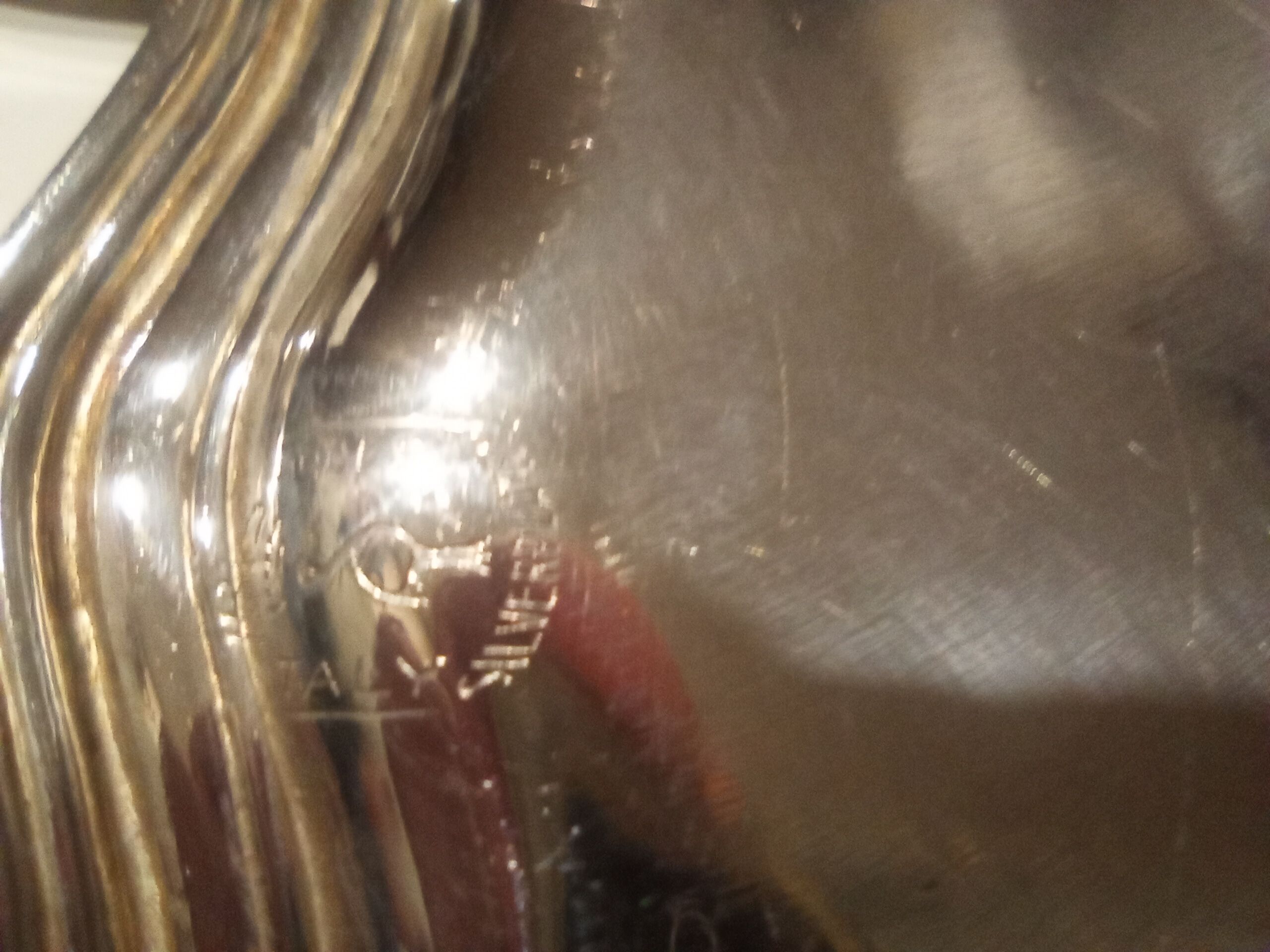 Four silver metal bottle bottoms