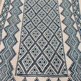 White and blue hand-woven rug in natural wool