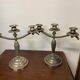 Pair of art deco style candle holders in silver metal