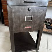 Vintage industrial filing cabinet on wheels