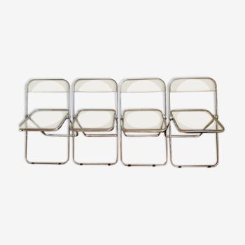 Quatre chaises pliantes Plia de Giancarlo Piretti éditées par Castelli