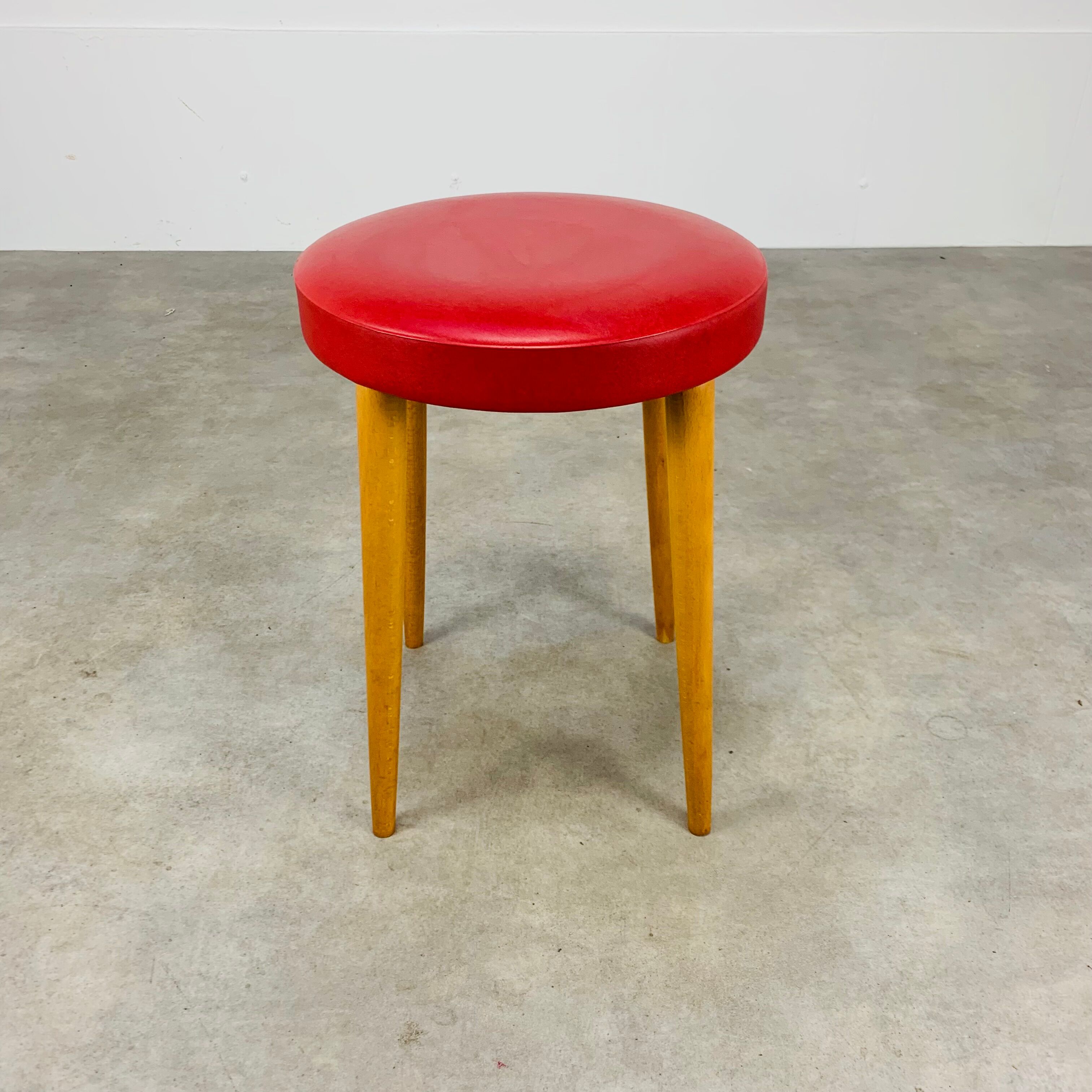 Baumann bistro stool wood and imitation red leather 60s