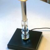 Silver floor lamp with a straight shade.