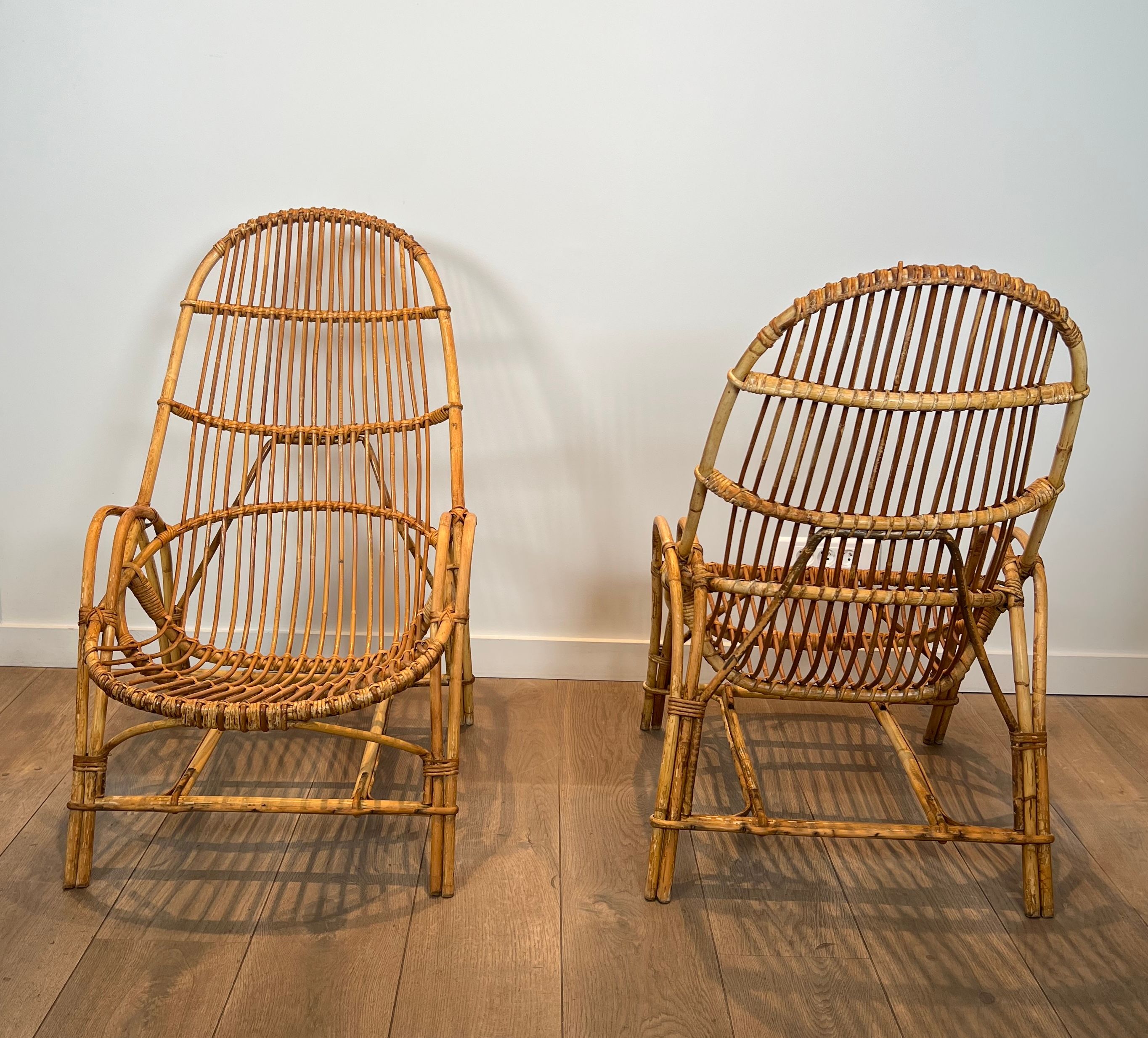 Pair of designer armchairs in rattan